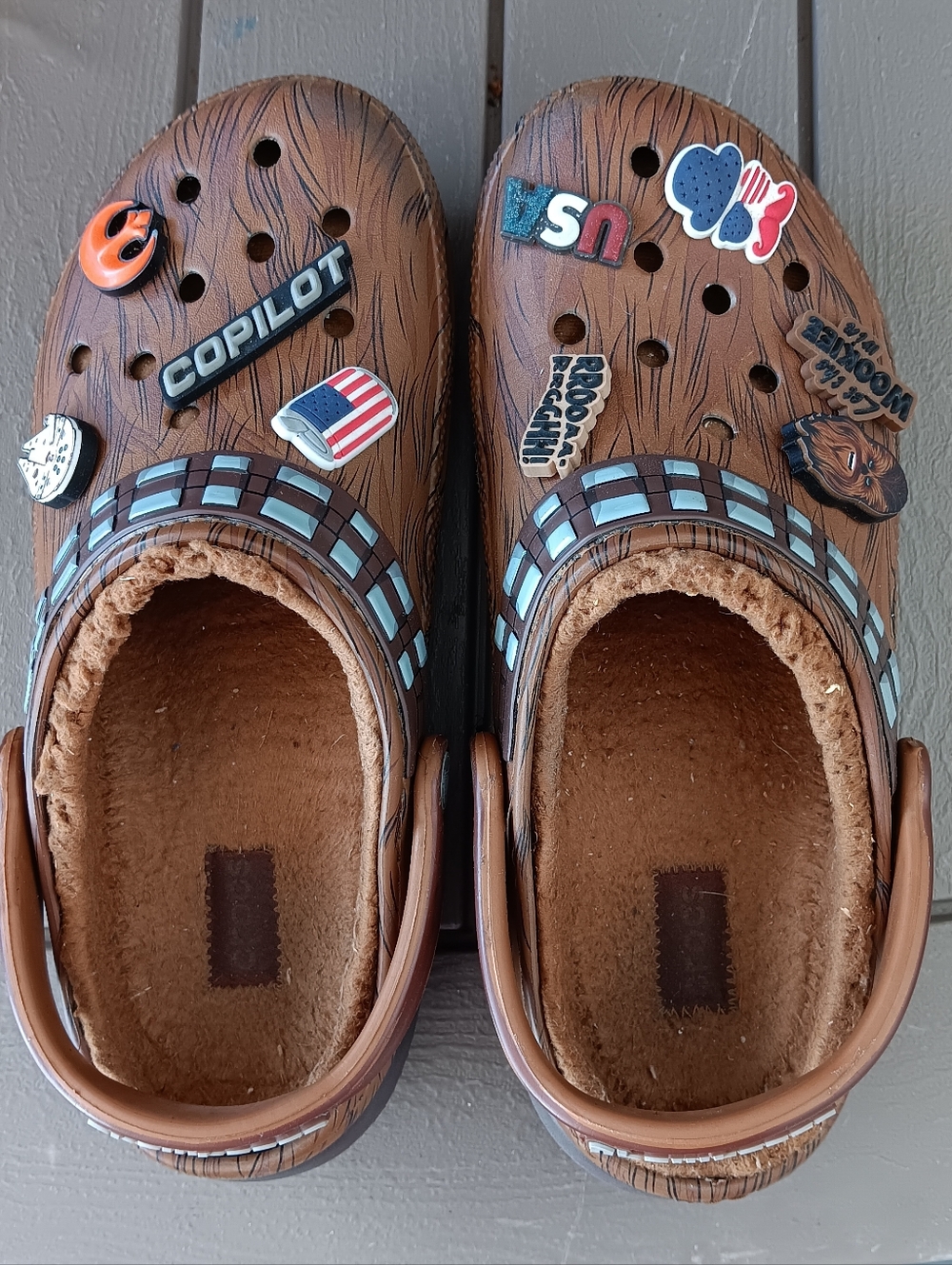 CROCS. Kids Brown Faux-Wood Slip-On Clog with Cozy Lining and Decorative Charms